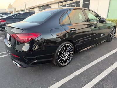 Black Mercedes-Benz C300, rear three-quarter view